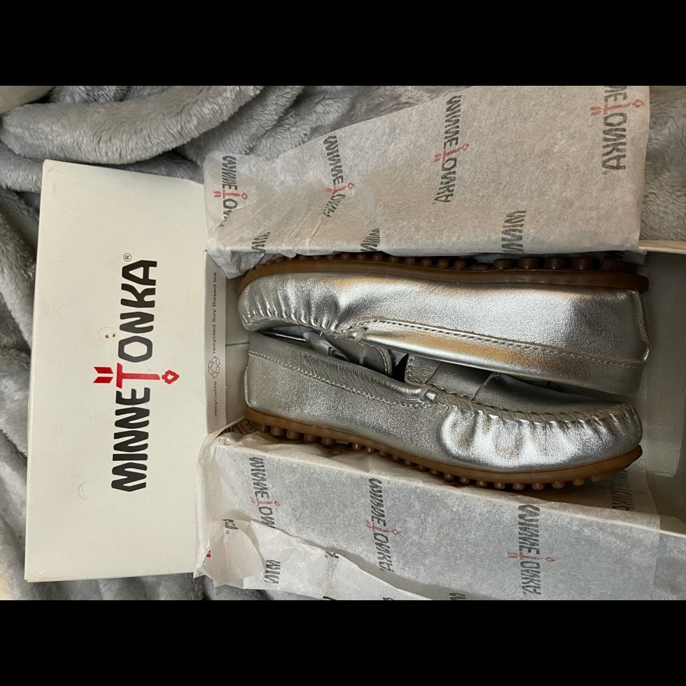 Silver minnetonka moccasins. Brand new in box